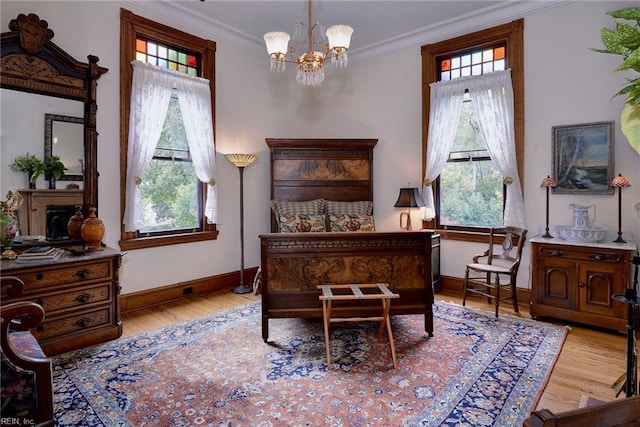 living area featuring a notable chandelier, crown molding, and light hardwood / wood-style floors