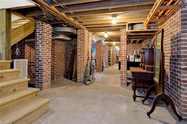 basement with brick wall