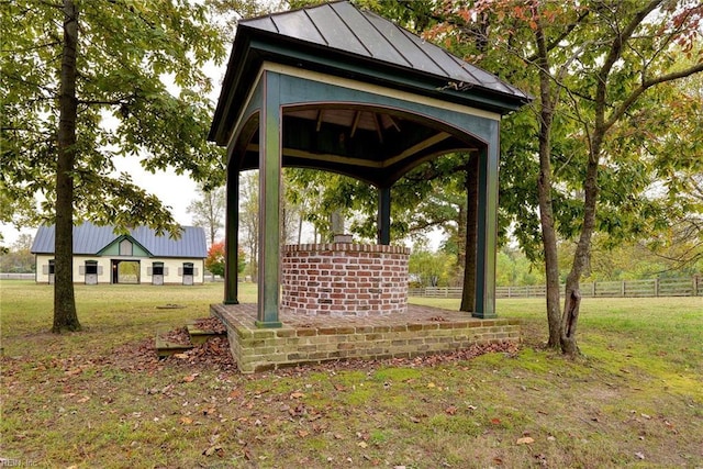 exterior space featuring a gazebo and a lawn