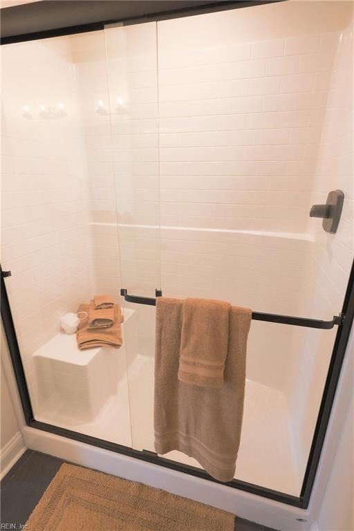 bathroom featuring an enclosed shower