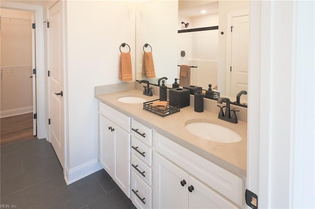 bathroom featuring tile patterned flooring and double sink vanity