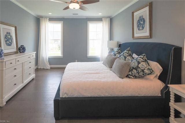 bedroom with dark hardwood / wood-style flooring, ceiling fan, and crown molding