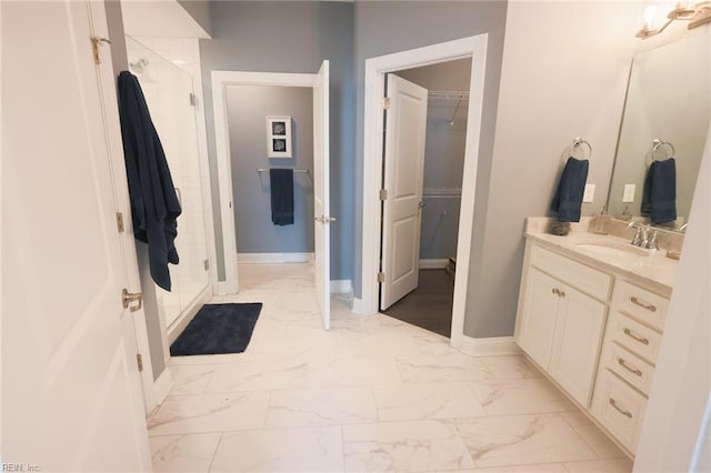 bathroom with vanity, walk in shower, and tile patterned flooring