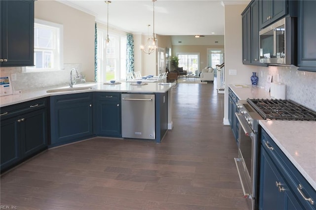 kitchen with dark hardwood / wood-style floors, stainless steel appliances, decorative backsplash, and sink