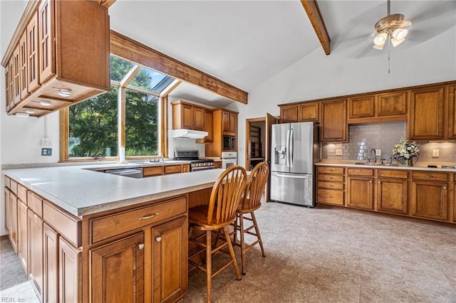 kitchen with backsplash, ceiling fan, beamed ceiling, sink, and stainless steel appliances