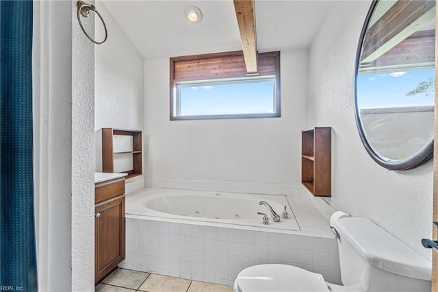 bathroom featuring tile flooring, beam ceiling, a relaxing tiled bath, toilet, and vanity