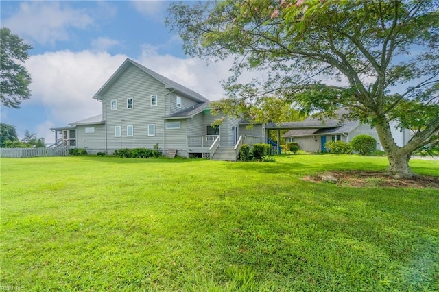 rear view of house with a lawn