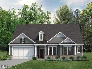 view of front of house with a front yard and a garage