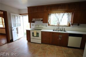 364 Millers Ln, Susan, VA 23163 - kitchen with white electric stove, a sink, light countertops, range hood, and dishwasher