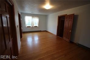 364 Millers Ln, Susan, VA 23163 - unfurnished bedroom with wood finished floors