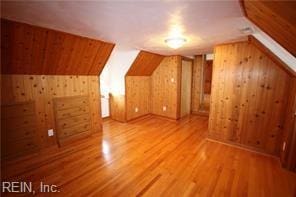 364 Millers Ln, Susan, VA 23163 - bonus room featuring wood walls, vaulted ceiling, and wood finished floors