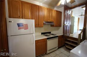 364 Millers Ln, Susan, VA 23163 - kitchen featuring brown cabinets, light tile patterned floors, a ceiling fan, white appliances, and under cabinet range hood