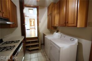 364 Millers Ln, Susan, VA 23163 - clothes washing area with laundry area, separate washer and dryer, and light tile patterned flooring