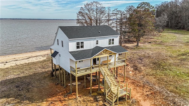 back of property with a water view