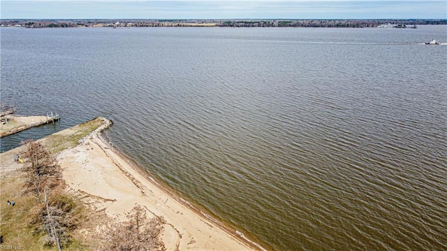 bird's eye view featuring a beach view and a water view