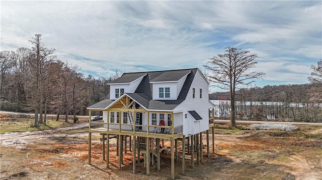 back of house featuring a porch