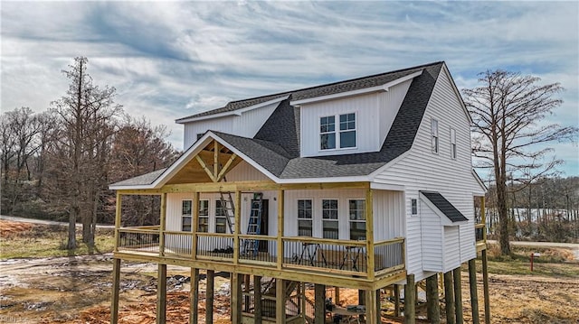 rear view of property featuring a deck