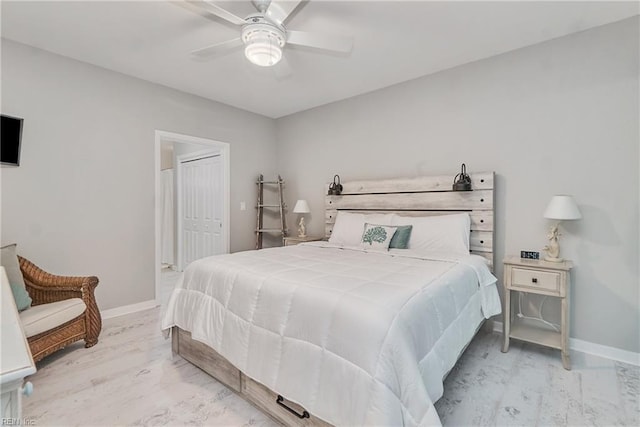 bedroom with a closet, ceiling fan, and light hardwood / wood-style flooring