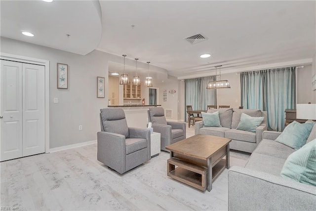 living room with an inviting chandelier