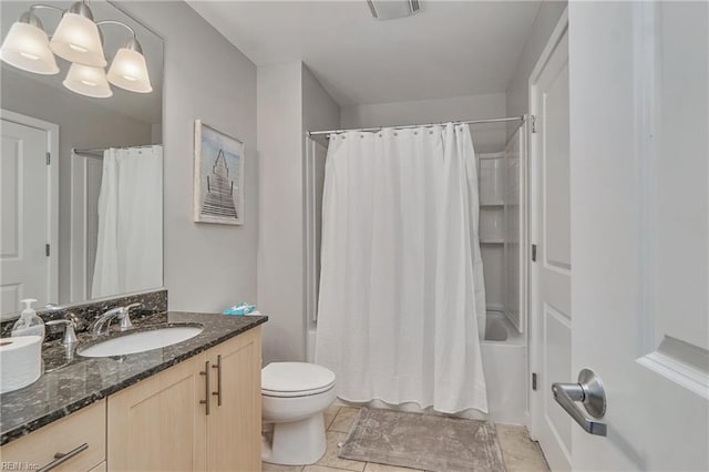 full bathroom featuring toilet, a notable chandelier, shower / bath combo with shower curtain, vanity, and tile flooring