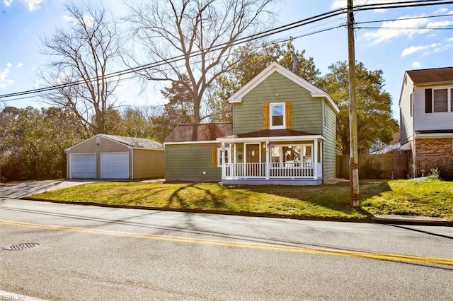 view of front of house featuring a front lawn, covered porch, and a garage