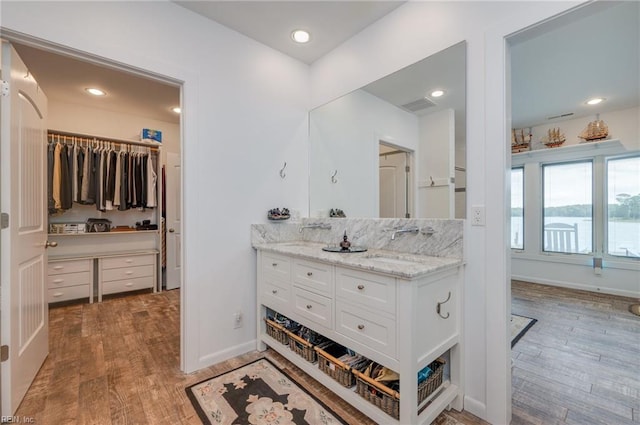 bathroom with vanity and hardwood / wood-style flooring