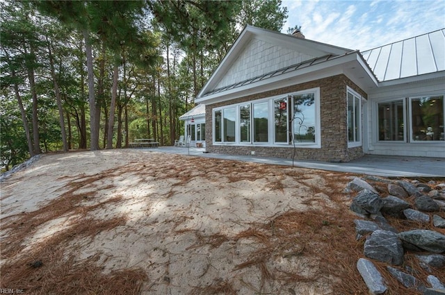 view of home's exterior featuring a patio