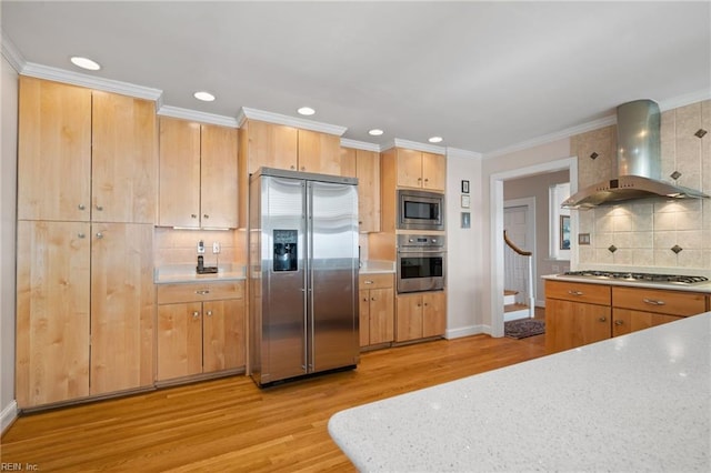 kitchen featuring appliances with stainless steel finishes, wall chimney range hood, backsplash, light hardwood / wood-style flooring, and ornamental molding