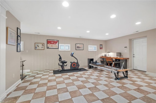 exercise room featuring light tile floors