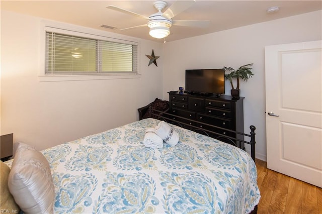 bedroom featuring ceiling fan and light wood-type flooring