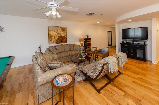 living room with pool table, ceiling fan, and light hardwood / wood-style flooring