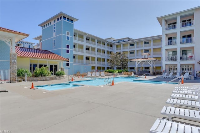 view of pool featuring a patio