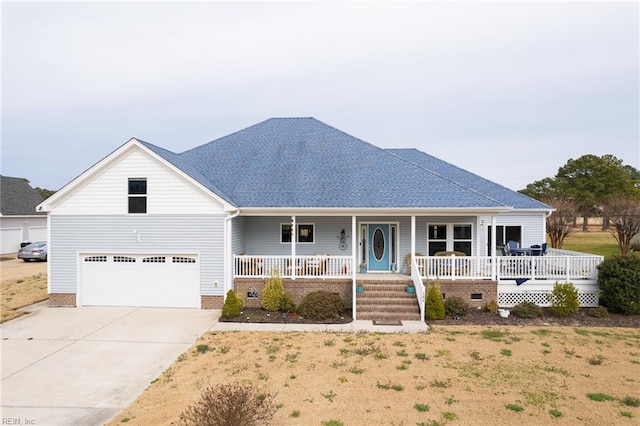 view of front of house featuring covered porch and a garage