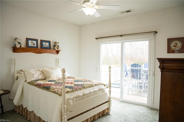 carpeted bedroom with ceiling fan, access to outside, and multiple windows