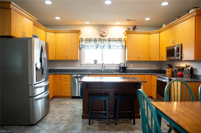 kitchen featuring sink, light tile floors, and stainless steel appliances