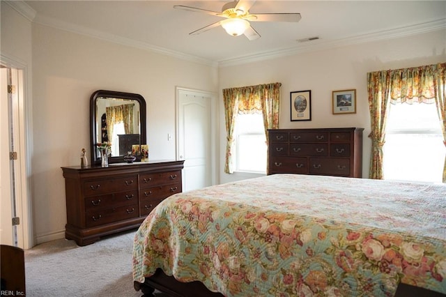 bedroom featuring ceiling fan, ornamental molding, and light carpet