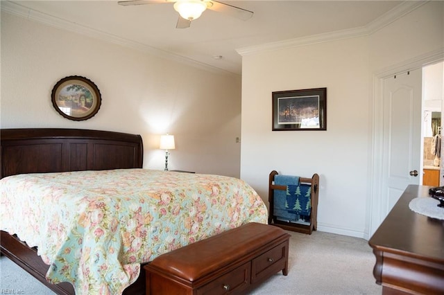 bedroom with light carpet, ceiling fan, ensuite bathroom, and ornamental molding