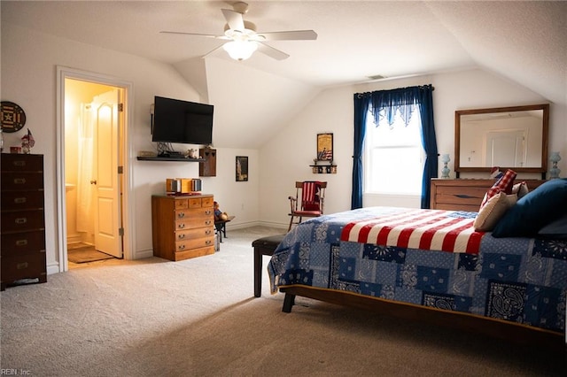 carpeted bedroom with lofted ceiling, ceiling fan, and ensuite bathroom