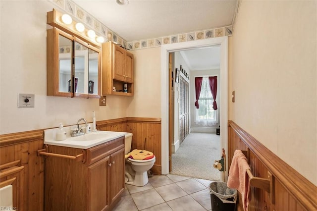 bathroom featuring vanity, tile flooring, and toilet