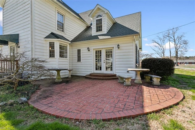 rear view of property featuring a patio and french doors