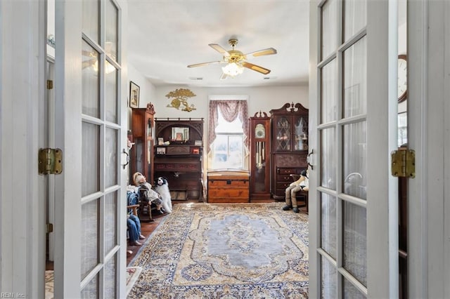 office area featuring ceiling fan, hardwood / wood-style flooring, and french doors