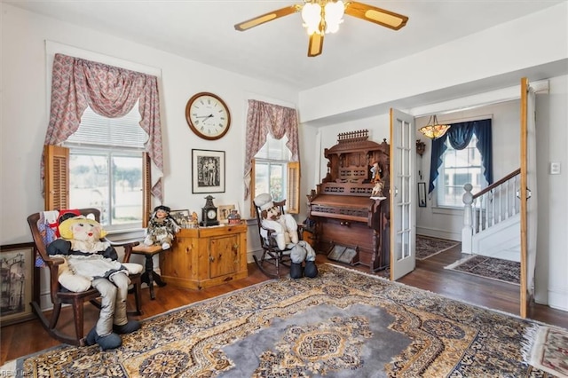 interior space featuring ceiling fan, dark wood-type flooring, and french doors