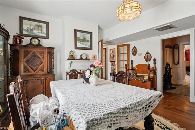 dining area with dark hardwood / wood-style flooring