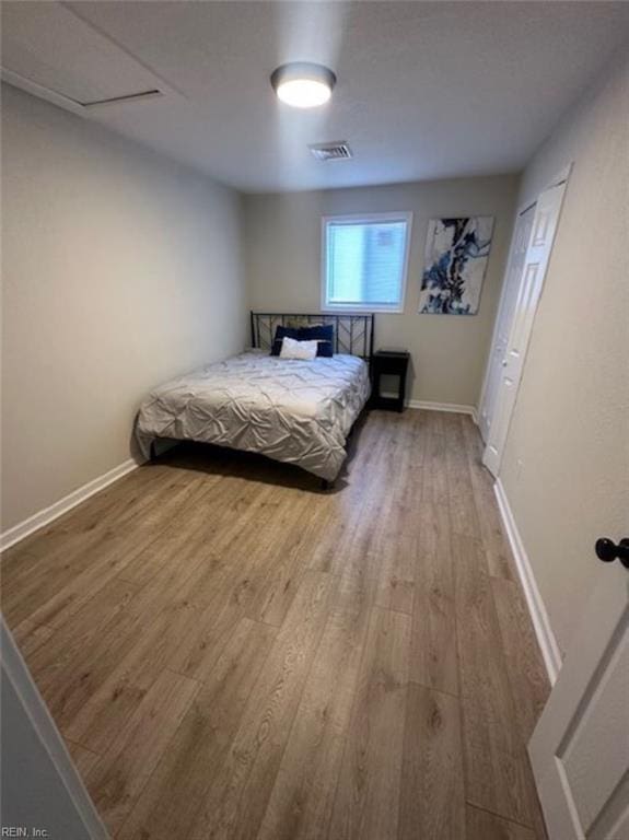 bedroom with wood-type flooring