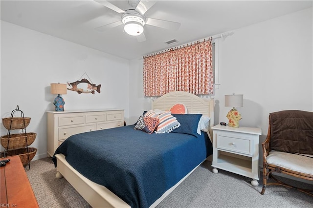 bedroom featuring light carpet and ceiling fan