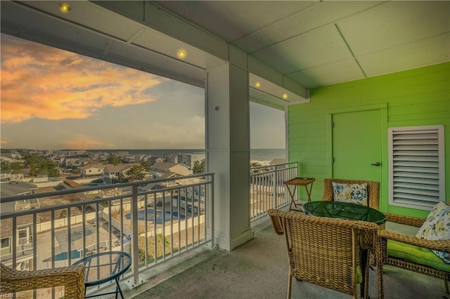 view of balcony at dusk