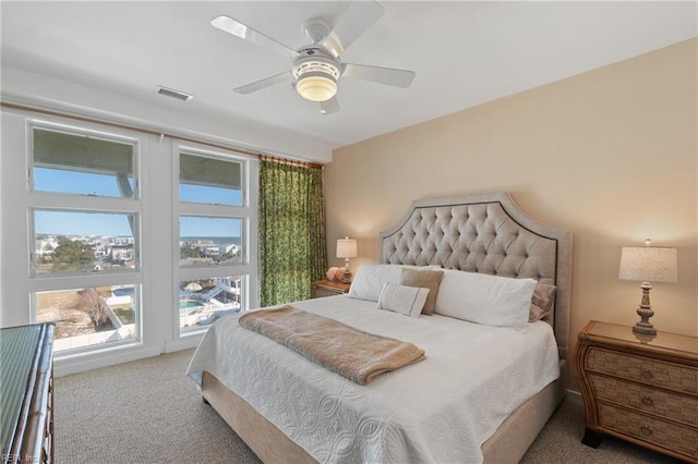 carpeted bedroom with ceiling fan