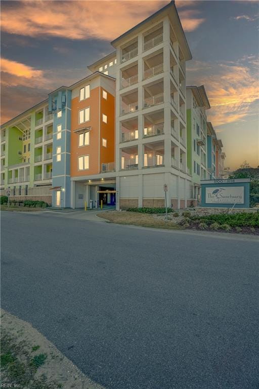 view of outdoor building at dusk