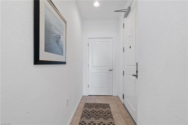 hall with light tile flooring