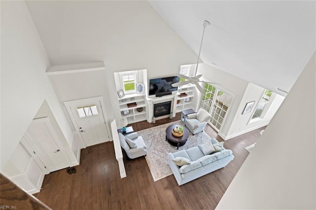 living room with high vaulted ceiling, ceiling fan, and dark hardwood / wood-style floors